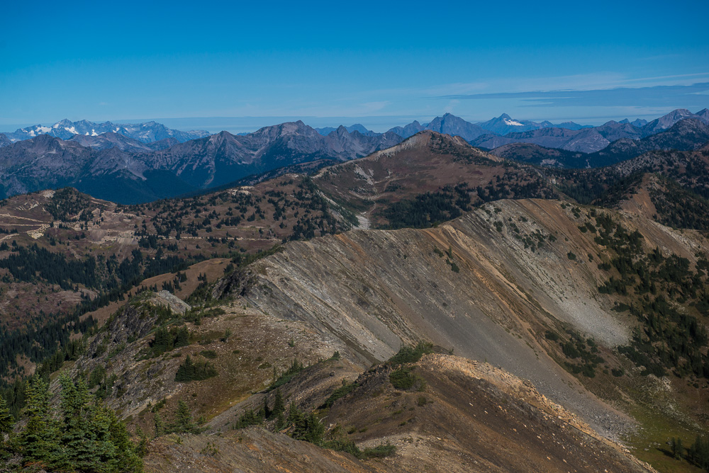 Looking north from Slate Peak. To the left, you can see the PCT. The snowy mountain on the right is Castle Peak, near the Canadian border.